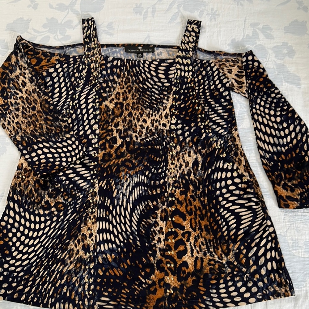 Cold shoulder long sleeve animal print top with gold studs trim. Size M